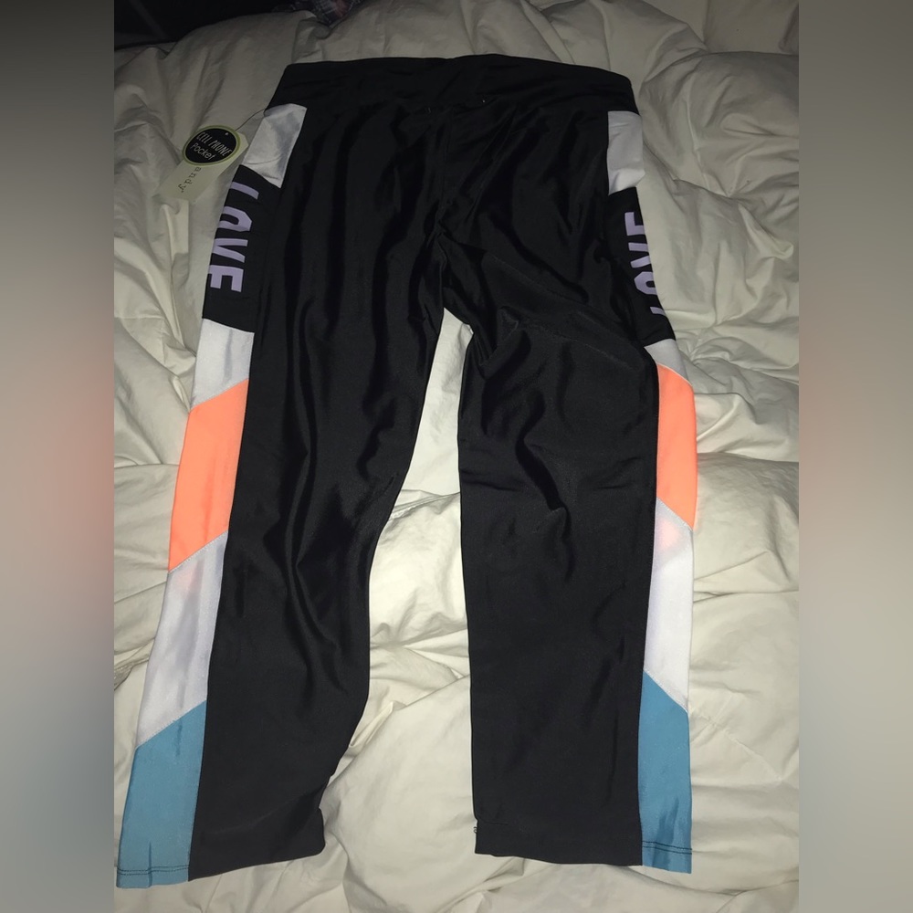 Eye candy  Leggins with cell phone pockets size large. Mid-Calf  NWT